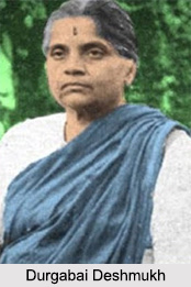 Small captioned photograph of Durgabai Deshmukh standing outdoors.