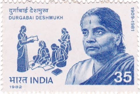 Blue Indian postage stamp of 1982 showing Durgabai Deshmukh and an adult education scene.