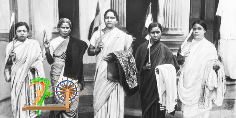 Five women in saris standing in a row on the steps of a colonnaded building, each holding a flag on a staff.